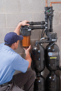 Service Technician Inspecting a Water Softener